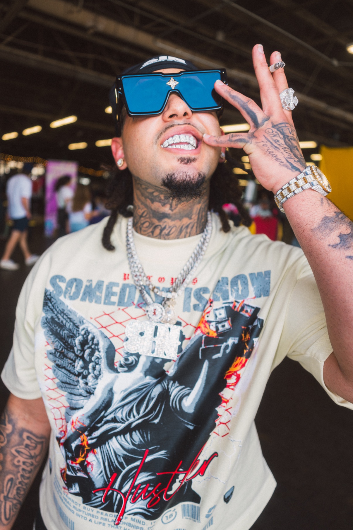 Street portrait, person with grillz and chains at a market
